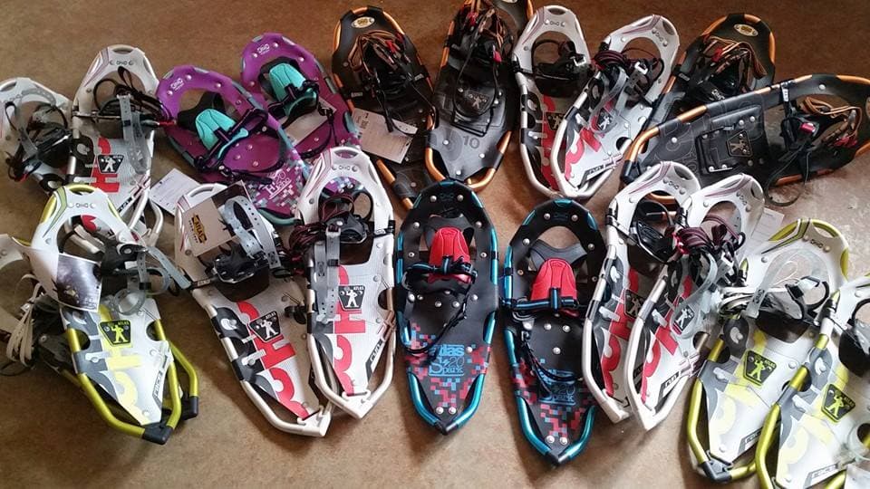 A collection of Mad Trapper snowshoes arranged on the floor