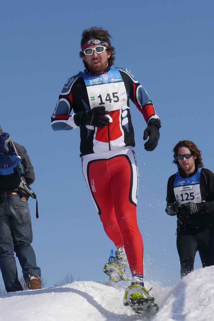 Mike Caldwell racing on snowshoes during a winter triathlon